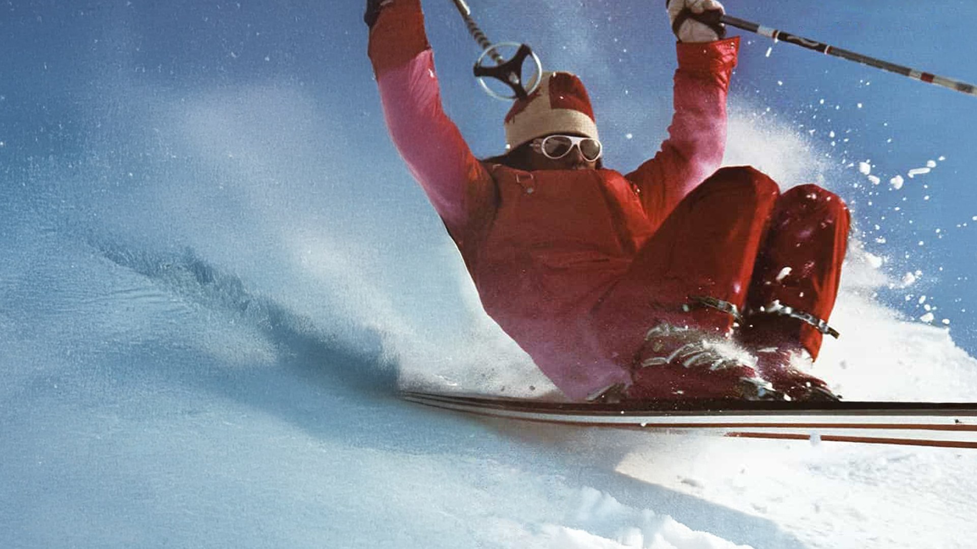 Archival photograph of Wayne Wong performing a freestyle trick in powder snow